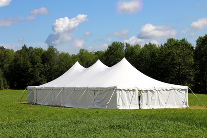 wedding or events tent in green grass field